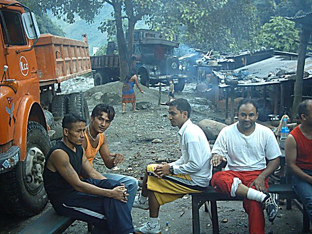 Raju (right) with their worship leader and some of the team meeting at roadworks on the trip to West Nepal